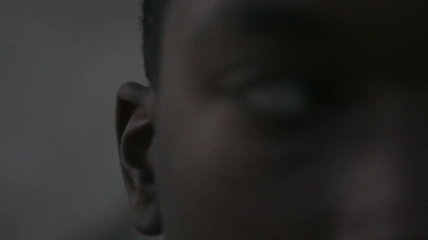 A young man blinks