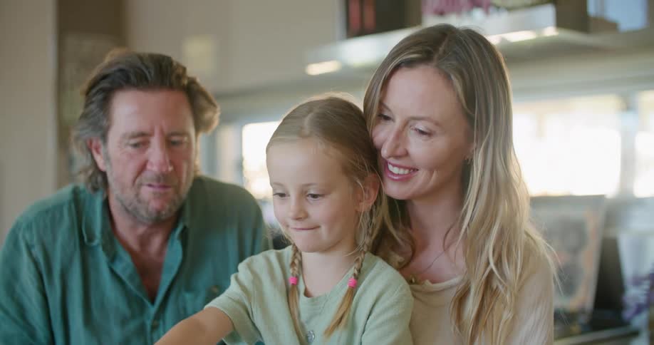 Young girl sitting with family