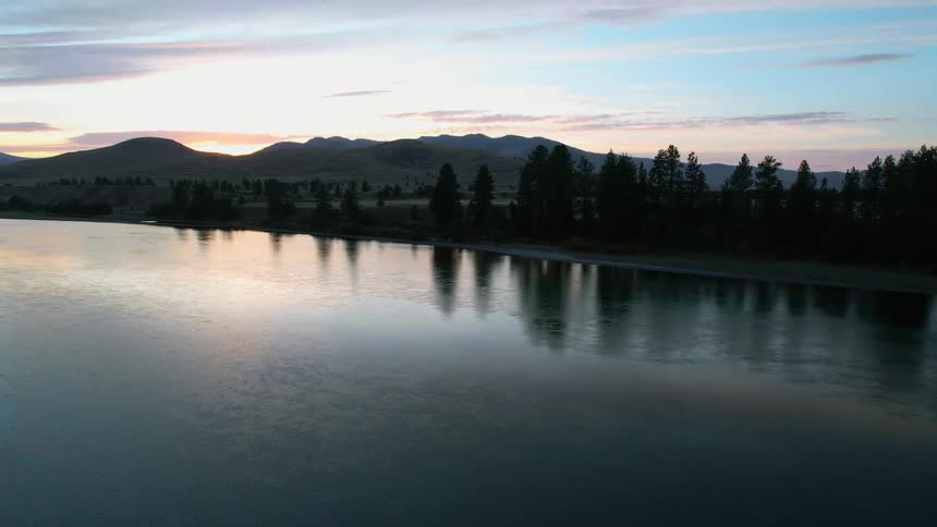 The sun is setting in the horizon in spring