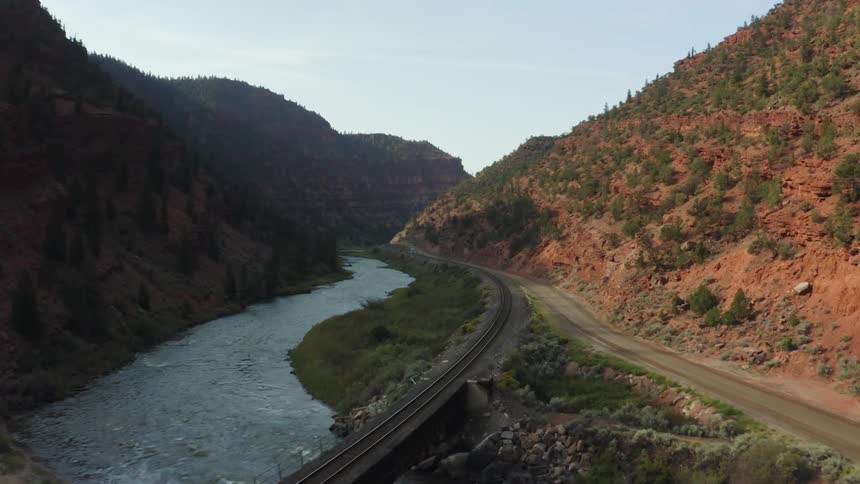 A river is flowing through a valley in spring