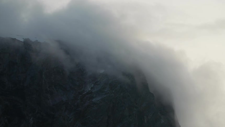 A view of clouds above a mountain