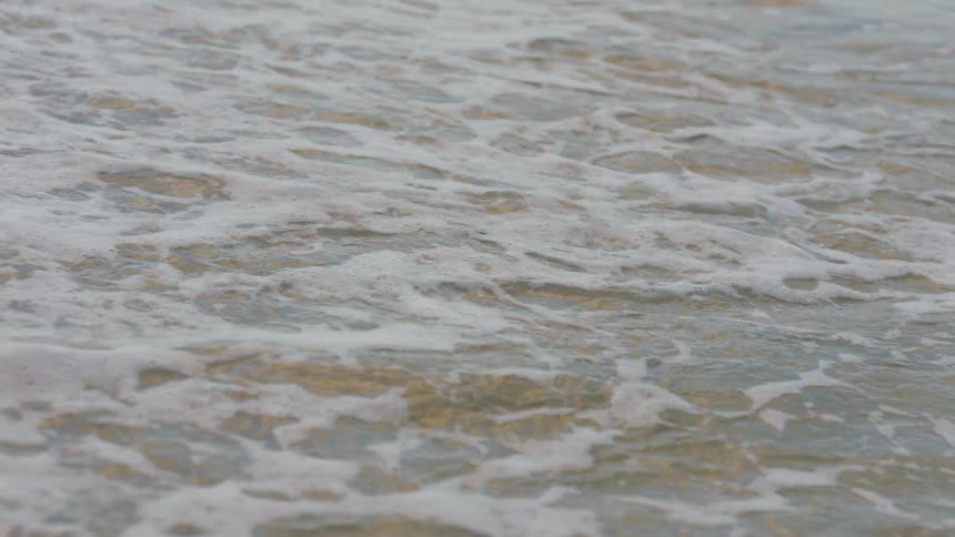 Waves roll in over the beach