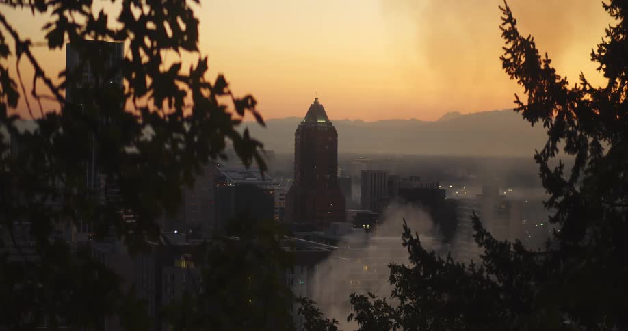 Smoke rises in front of the city