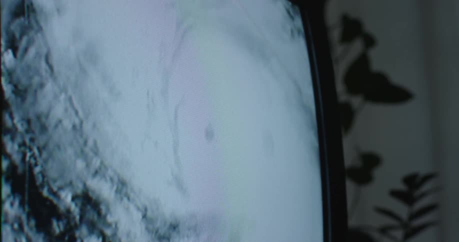 The eye of a hurricane shown on a television screen