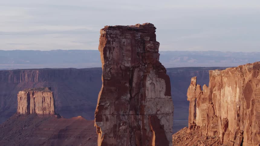 A tall rock formation stands out in the canyon