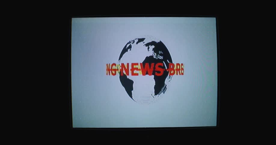 A television screen with a globe and text spinning on it