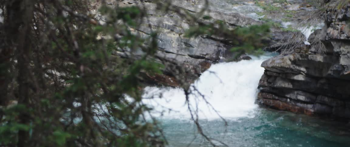 A river is flowing between cliffs in spring