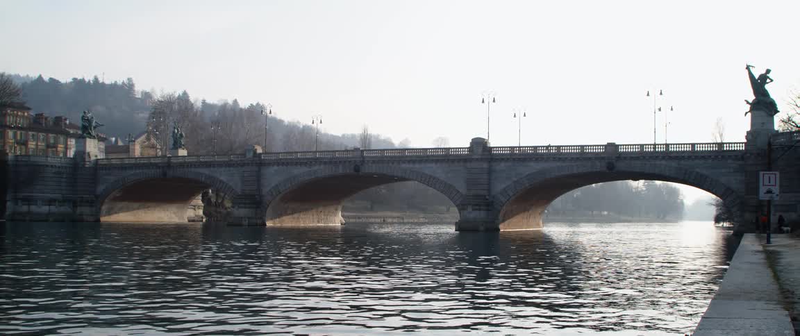 The bridge has a statue on both sides