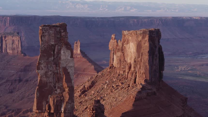 Tall rock formations jut up from a canyon