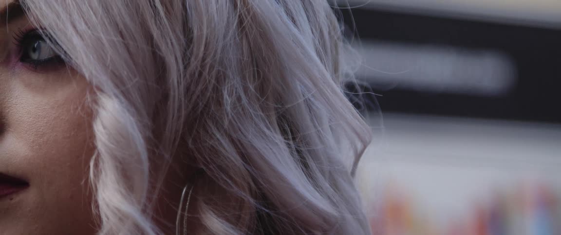Close up view of a woman wearing makeup
