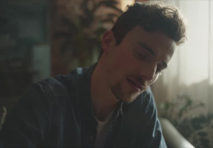 Man smiles then makes some changes before smiling again