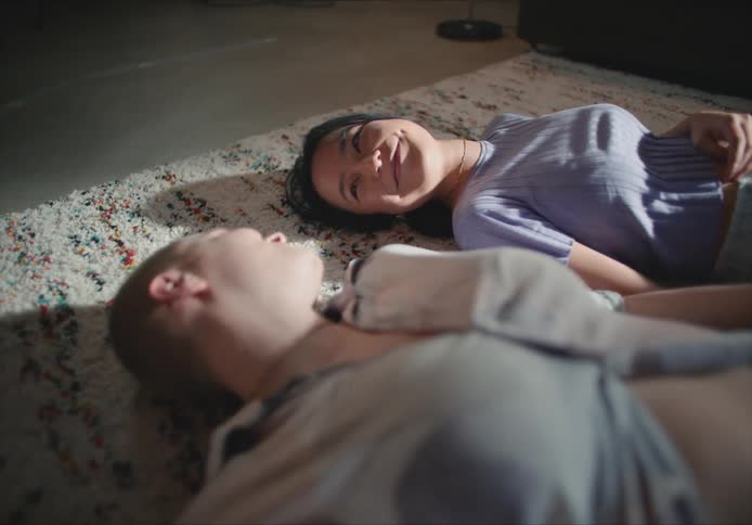 Females lying on floor talking