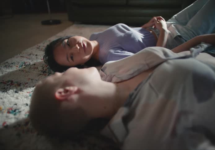 Females lying on ground talking