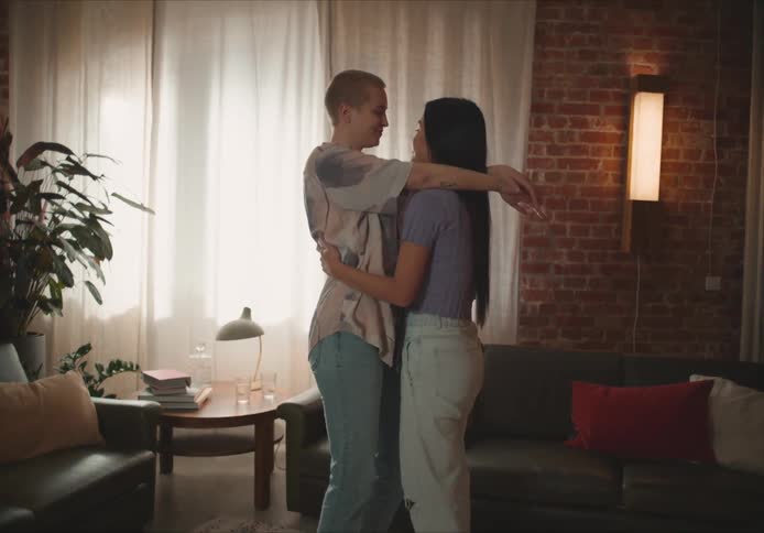 People hugging and swaying