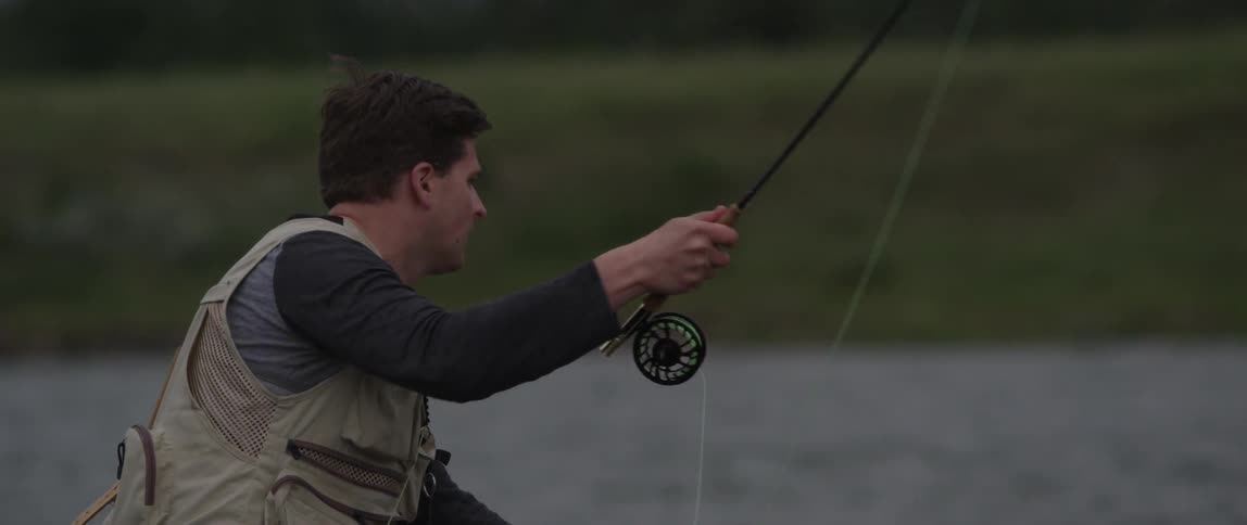 A man fishes in a river