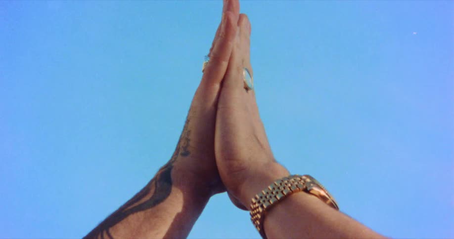 A person presses their hands together