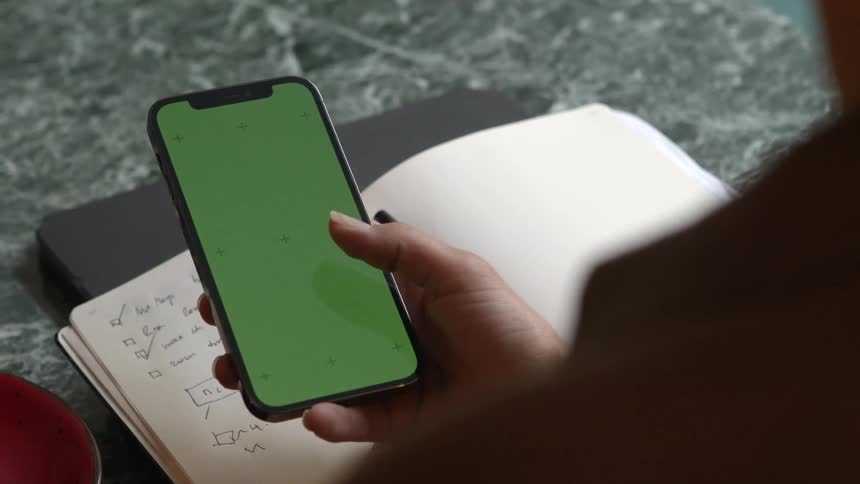 A female person is using their cell phone