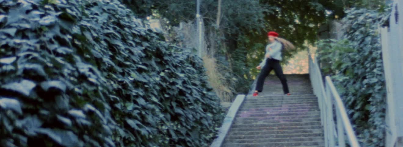 A woman is dancing on the steps