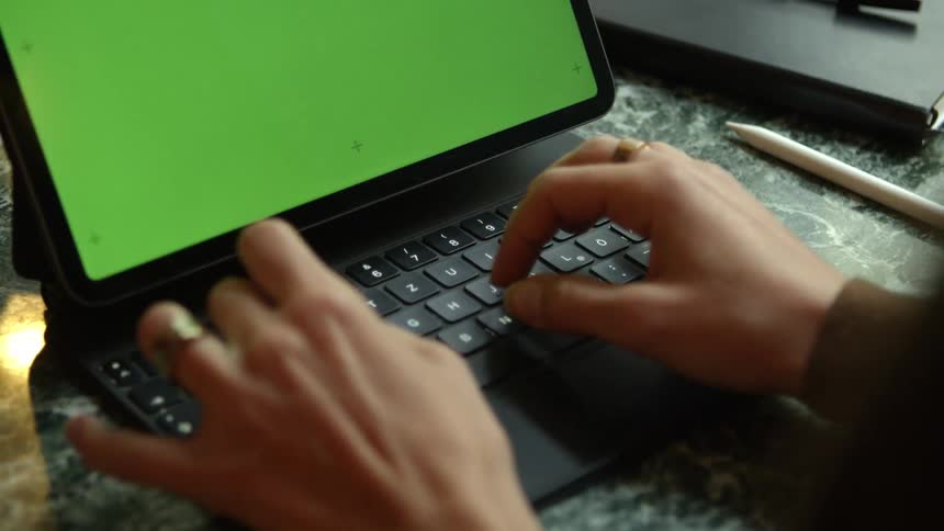 A person is typing on the keyboard