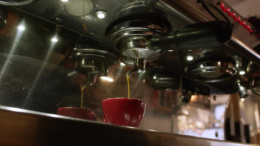 A server takes the latte from the machine