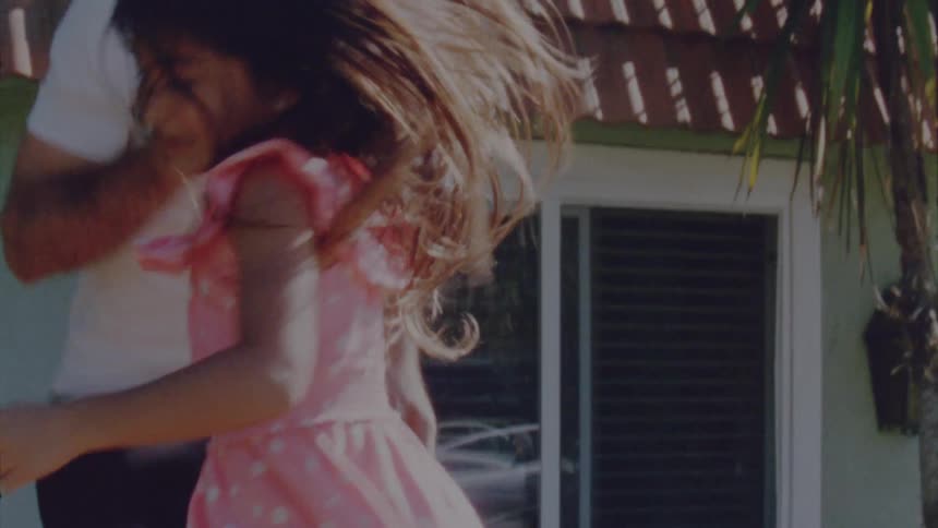 Father and daughter are playing outdoors in spring