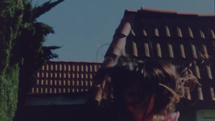 A child is jumping outdoors in spring
