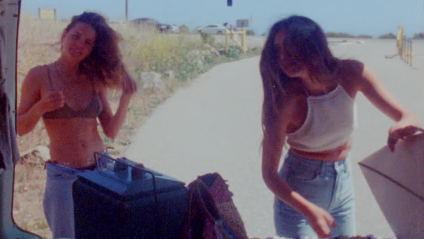 Females putting items in car