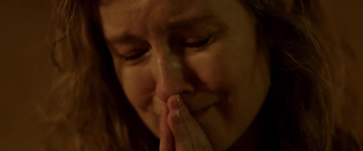 A sad woman crying and praying