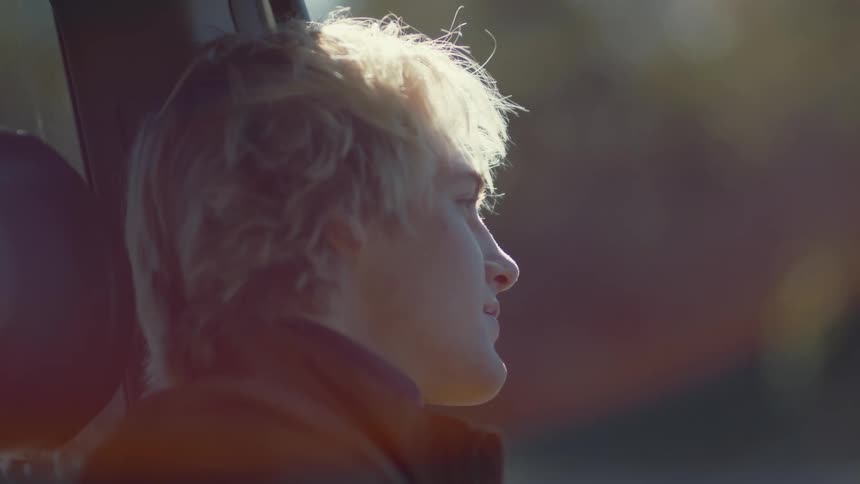 Person watching cars go by