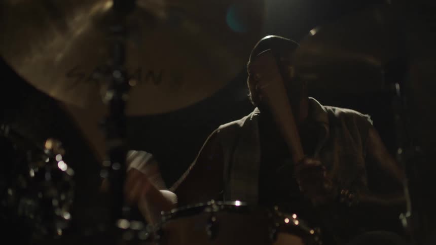 Male playing the drums