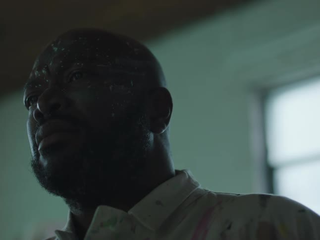 A man is sweating in the dark room