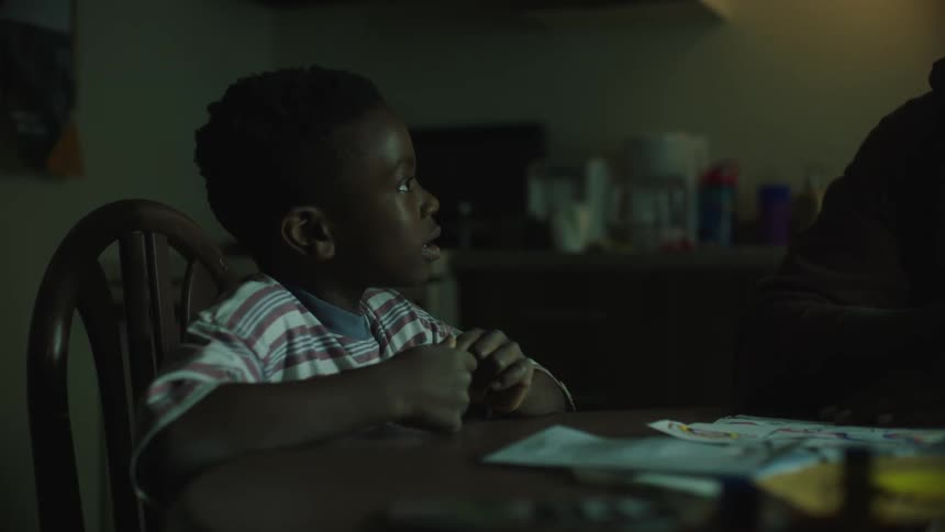 Child talking at table