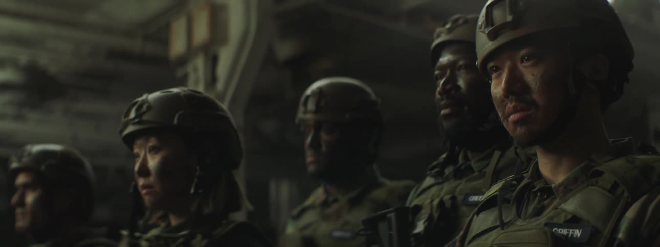 Group of soldiers stand together in the city at night