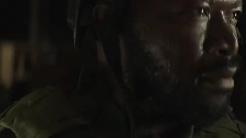 Lights flash on a soldiers face