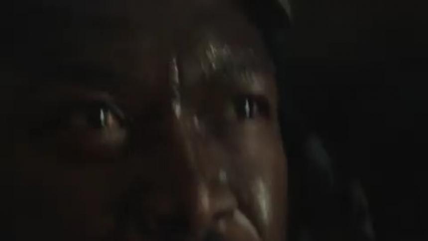 Lights flash on the sweating mans face