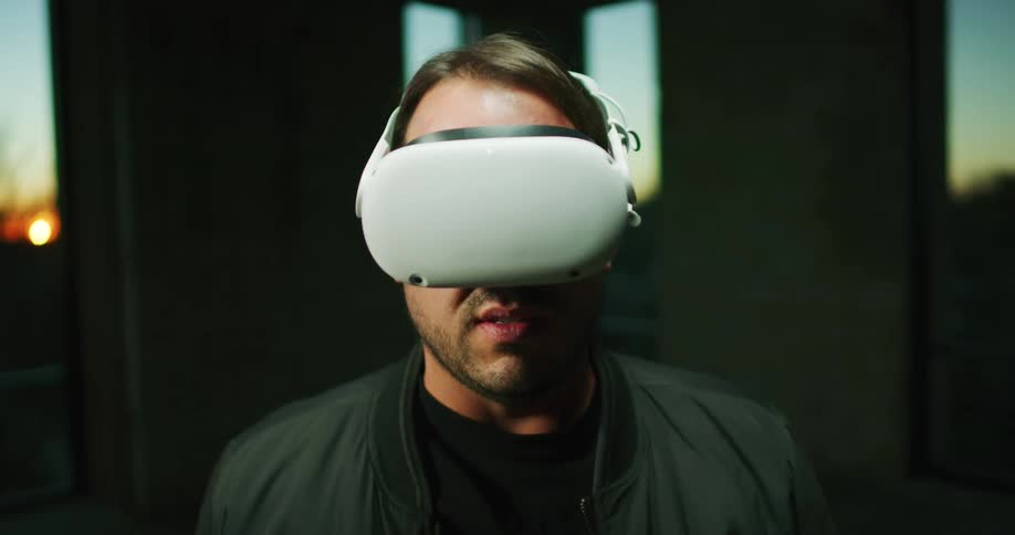 A man puts a virtual reality headset on