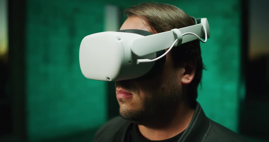 A man puts on a virtual reality headset