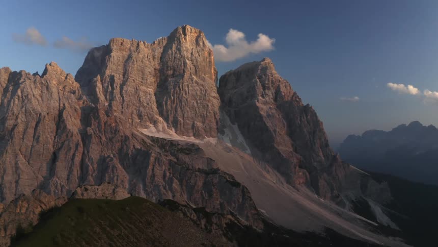 The tall mountain is covered in mist
