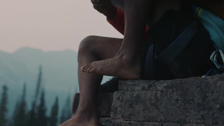 Person taking off sock