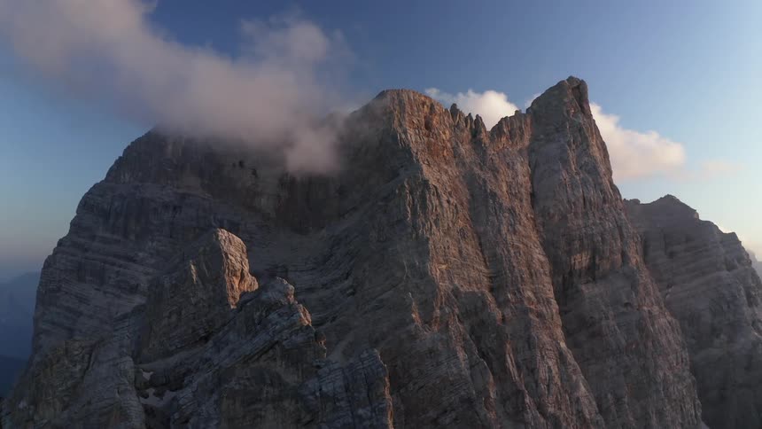 The cloud touches the mountain top