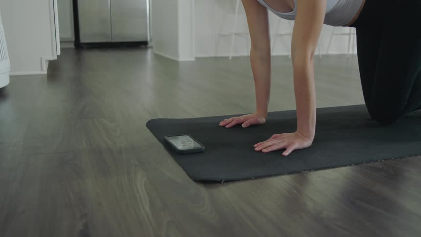 A woman doing yoga in a room