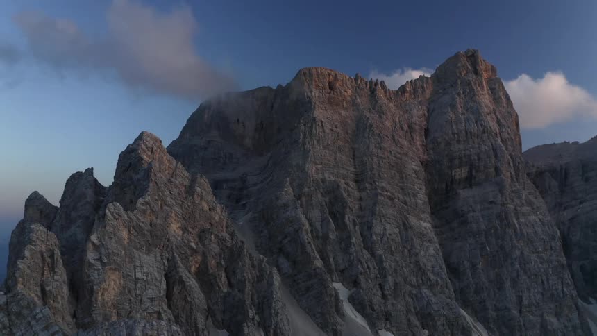 Mountains with peaks high among the clouds