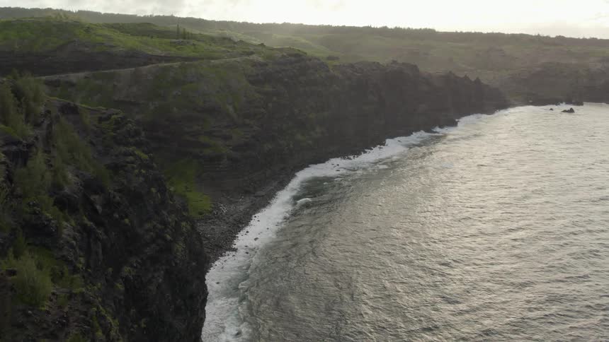 Aerial view of shoreline with steep and vertical cliffs