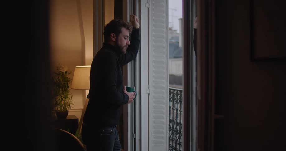 Person looking out window