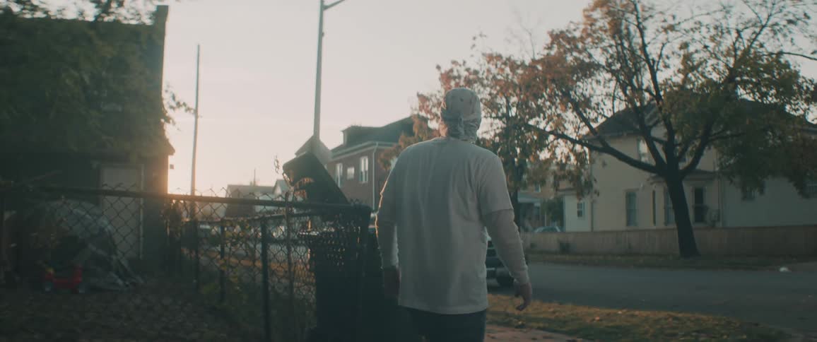 A man is walking to the corner in town