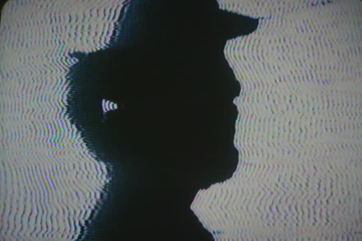 The image on the screen is dark and full of static