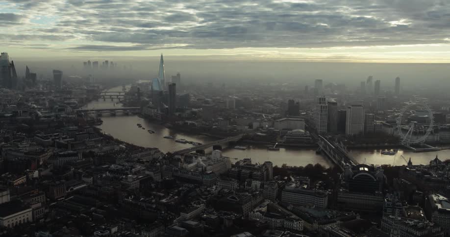 The sun is rising on the large city