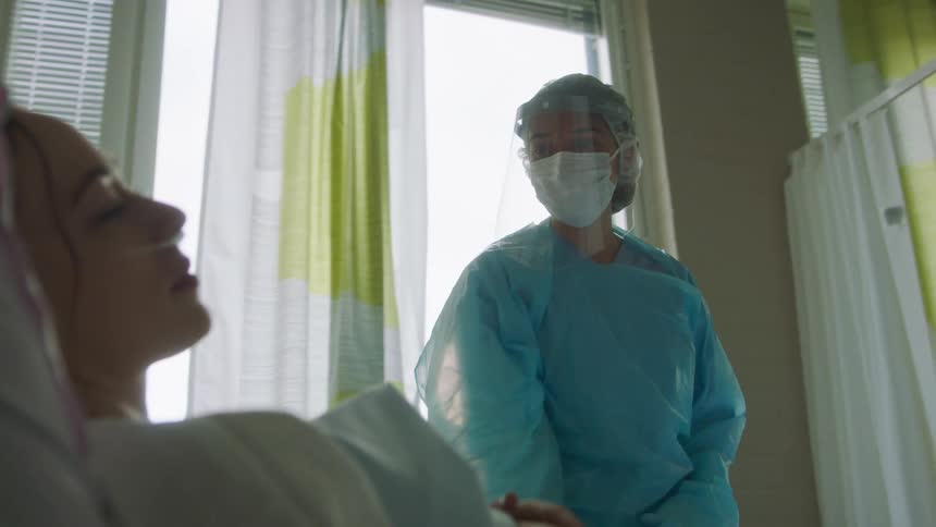 A view of a doctor in an office with a patient