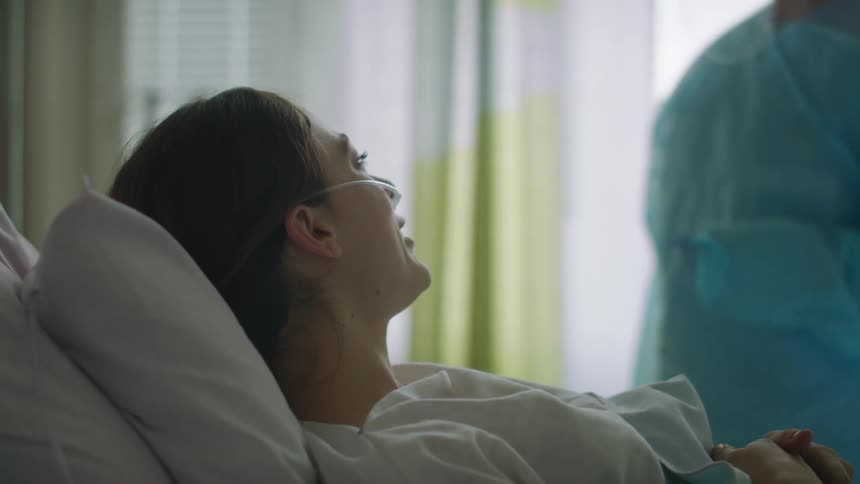 Woman patient waking up happy to see the nurse