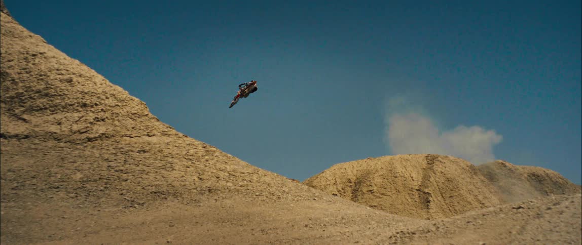 A view of a person jumping a dirt bike